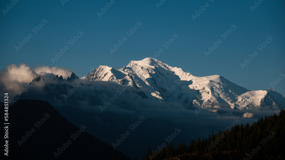 Landscape of Mont Blanc massif over the clouds at sunrise.