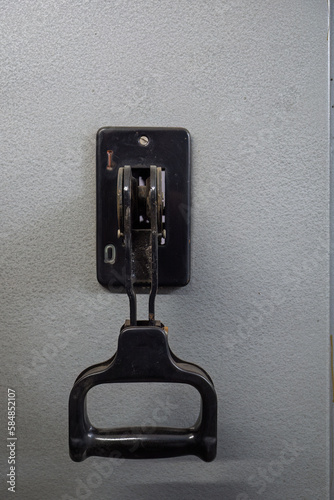 The old plastic lever is off in the substation.