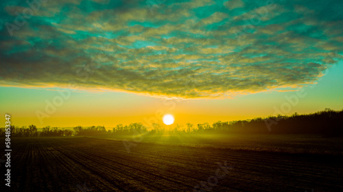 Extraordinary sunrise over a field © Milton