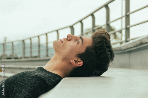 portrait of handsome guy lying down 
