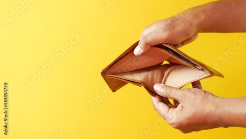 Man hand open an empty wallet with copy space.