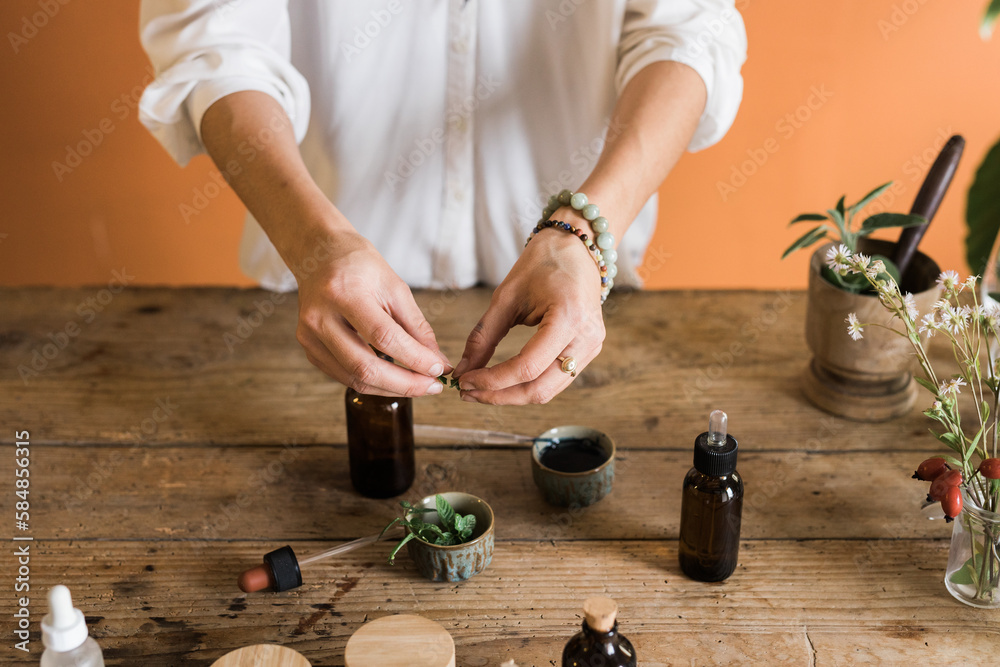 © Studio Serra/Stocksy - Naturopath Preparing Essential Oils