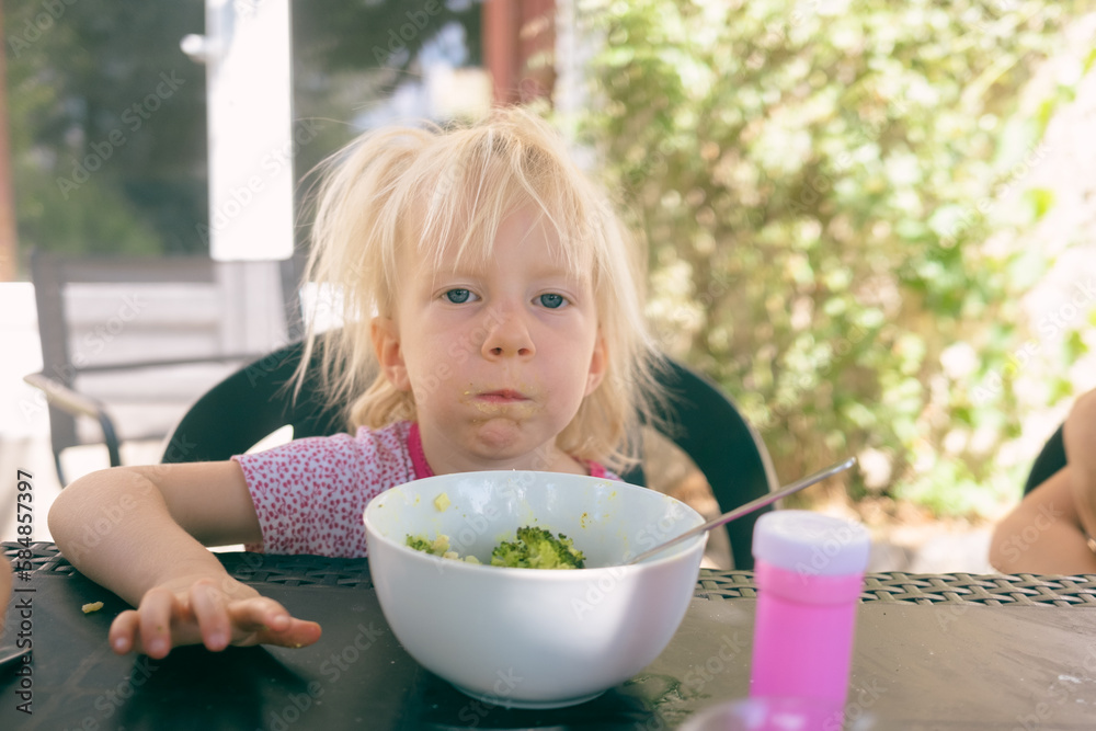 toddler with mouthful of food toddler with mouthful of food