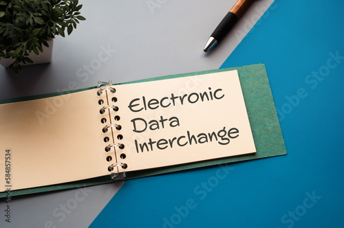 There is a notebook with the word Electronic Data Interchange. It is eye-catching image. photo