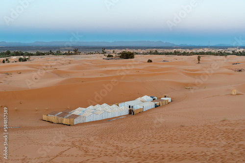 Desert Camp On Sand Dunes at sunrise photo