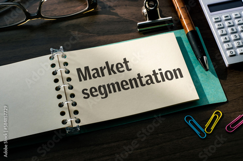 There is a notebook with the word Market segmentation. It is eye-catching image. photo
