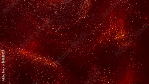 Bursting Gold Dust Particles in Red Liquid. Abstract moving gold particles in red fluid. Abstract luxe background of Shiny Floating Golden Dust Movement.