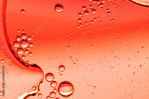 Abstract Red Background With Oil Drops On Water photo