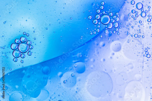 Blue Oil Drops On Water Surface   photo