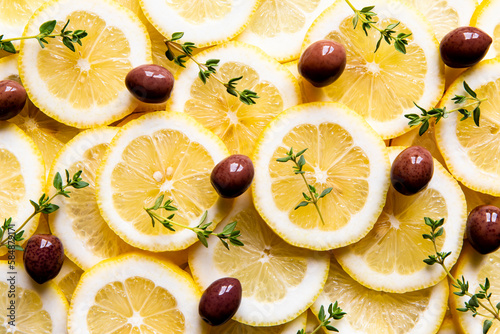 Fresh food ingredients with lemon, olives and herbs