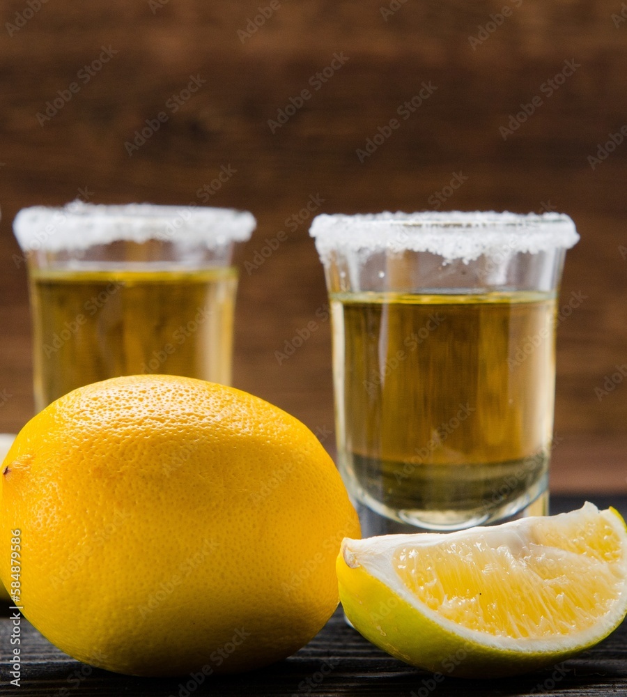 Tequila drink served in glasses with lime and salt Tequila drink served in glasses with lime and salt