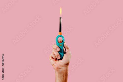 man lights a gas lighter