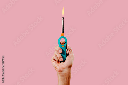 man lights a gas lighter photo