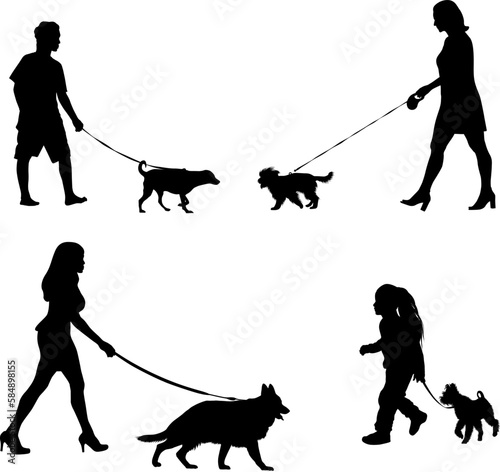 woman and kid walking with his dog silhouettes.