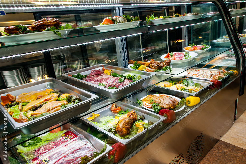 Buffet raw food in a restaurant freezer