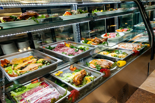 Buffet raw food in a restaurant freezer
