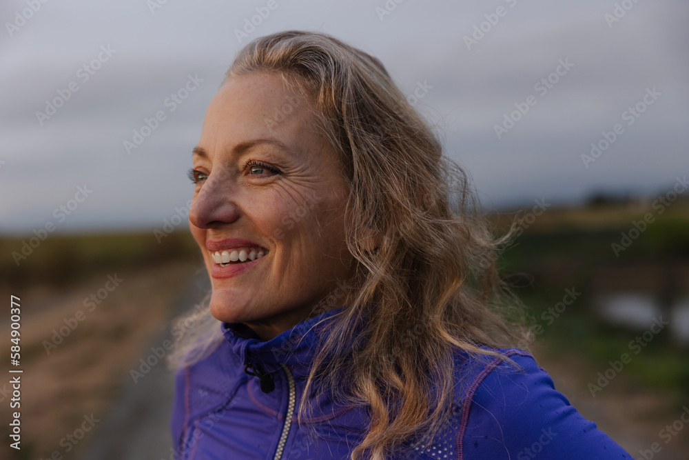 Fit woman breathing hard after run exercise outside. Fit woman breathing hard after run exercise outside.