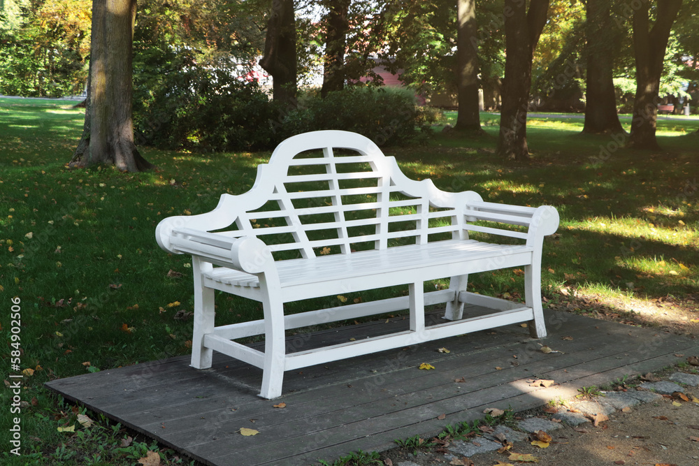 Beautiful white bench in public city park Beautiful white bench in public city park