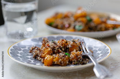 Healthy vegetarian warm salad of pumpkin and quinoa.