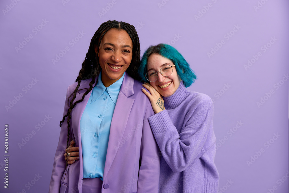 Happy diverse women in stylish clothes