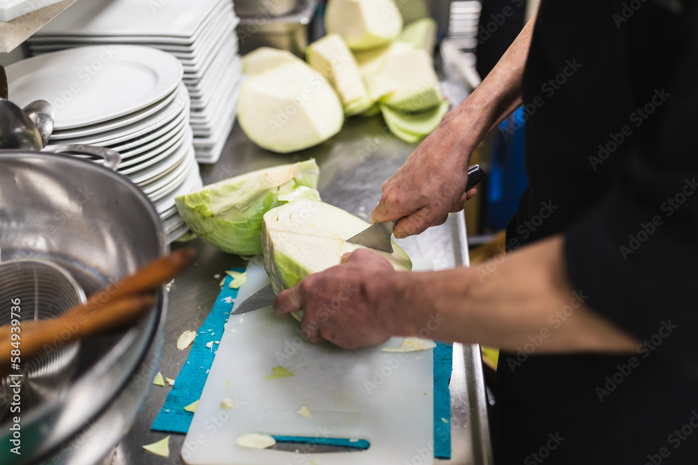 © Diego Martin/Stocksy - Unrecognizable person working in a kitchen © Diego Martin/Stocksy - Unrecognizable person working in a kitchen