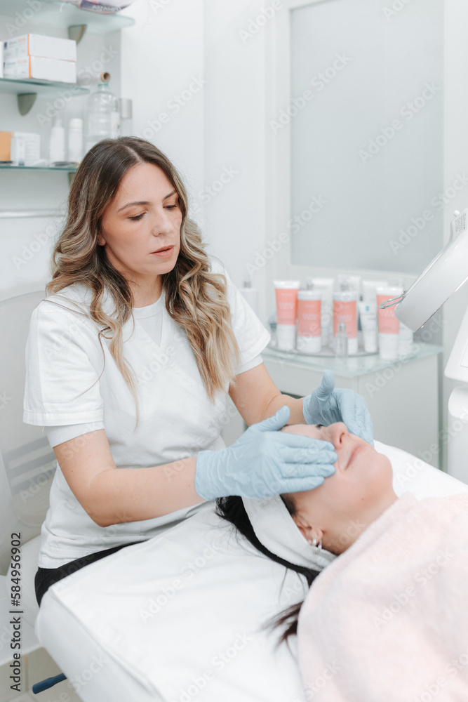 Woman Having Face Massage. Woman Having Face Massage.