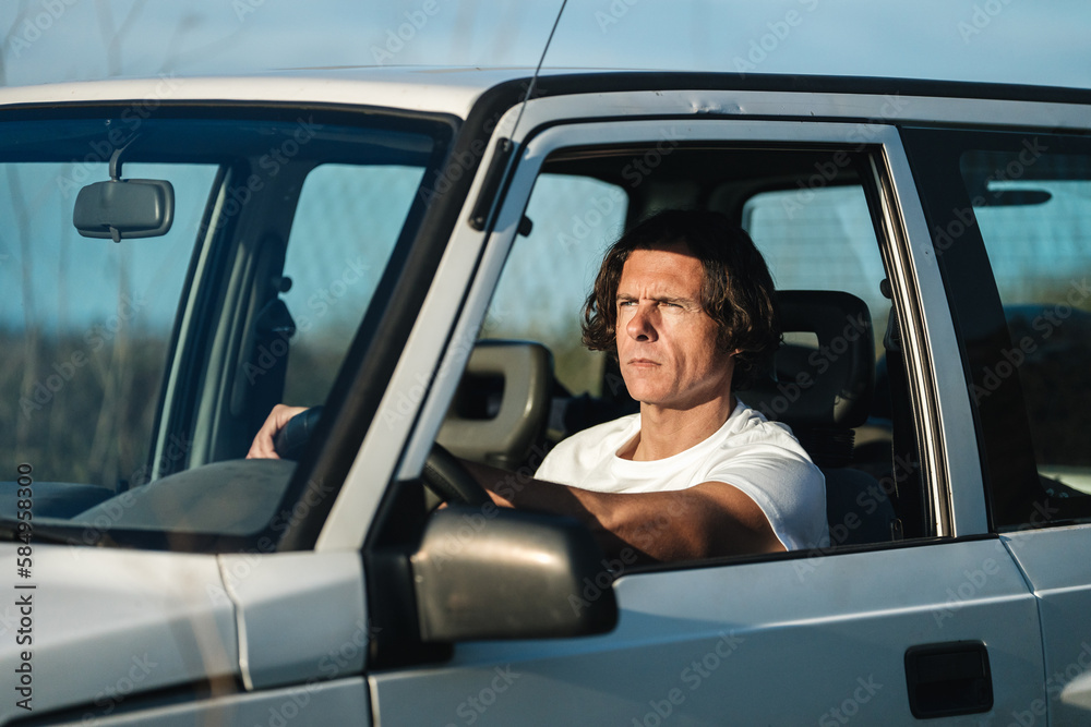 Concentrated man driving a car Concentrated man driving a car