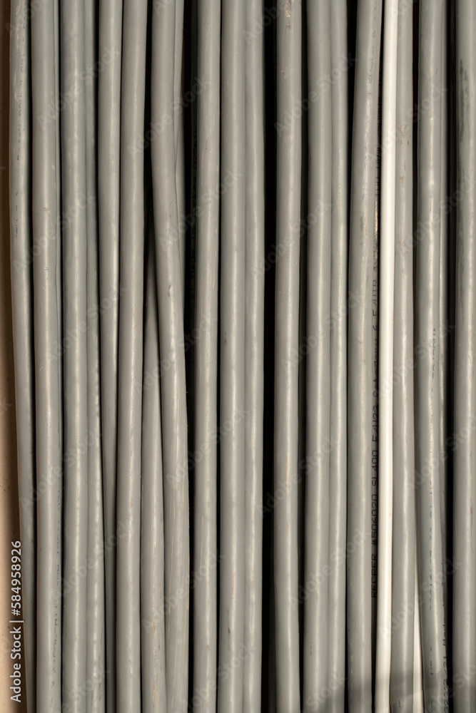 Large group of UTP cables, Ethernet cables in rack cabinet, UTP cables from a patch panel in the server rack in the data center room.