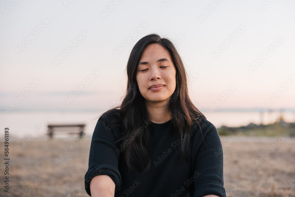 Simple portrait of woman sitting outside in the evening. Simple portrait of woman sitting outside in the evening.