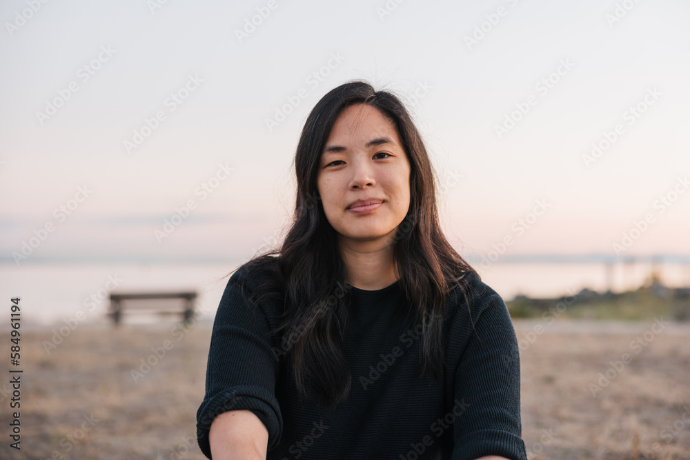 Simple portrait of woman sitting outside in the evening. Simple portrait of woman sitting outside in the evening.