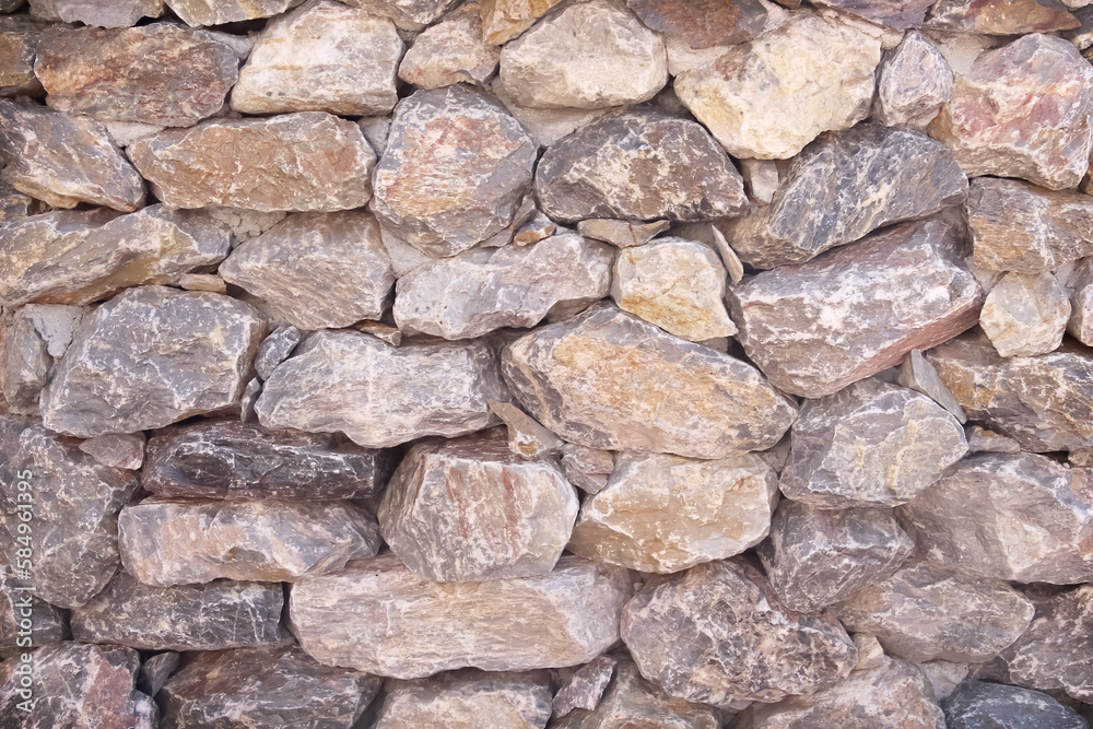 Stone wall background brown texture with seamless overlap patterns Stone wall background brown texture with seamless overlap patterns