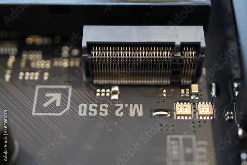 Closeup of an M.2 SSD slot on a Asus TUF Gaming Z790-Plus Wifi motherboard photo