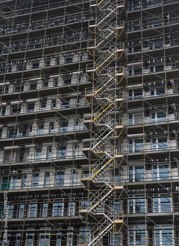 scaffolding and stairs on apartment building photo