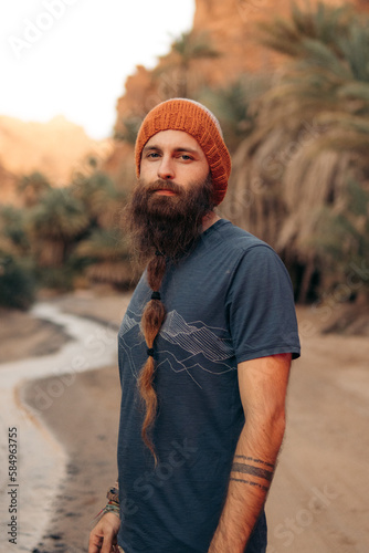 Adult man portrait in the desert of saudia arabia photo