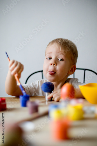 Boy painted the eggs photo