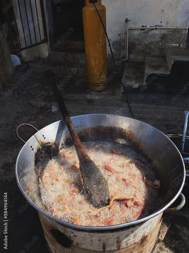 Pork skin frying in deep oil Pork skin frying in deep oil