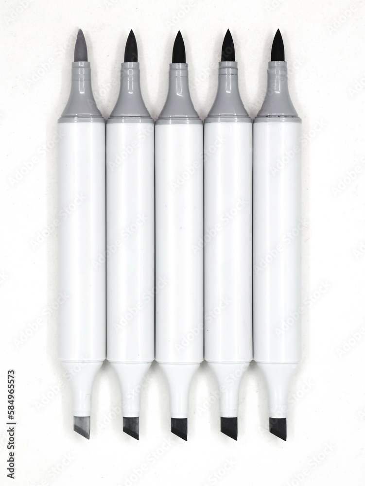 set of gray sketch pens or markers with open tips used by designers isolated in a white background set of gray sketch pens or markers with open tips used by designers isolated in a white background