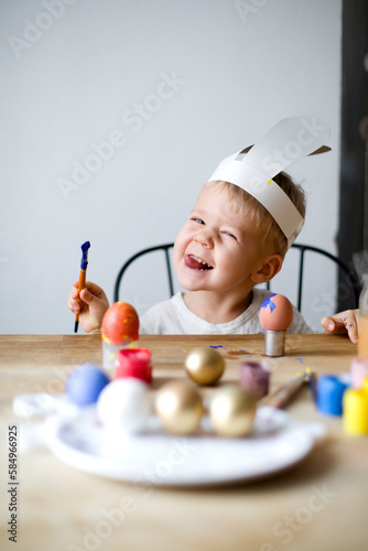 Boy painted the eggs photo