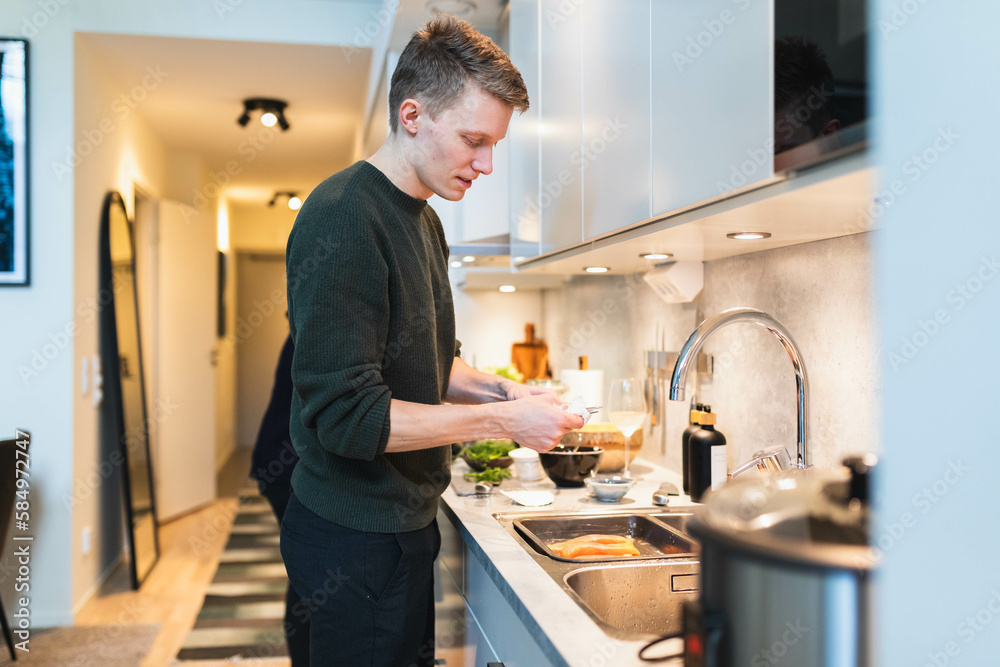 Young man preparing food Young man preparing food
