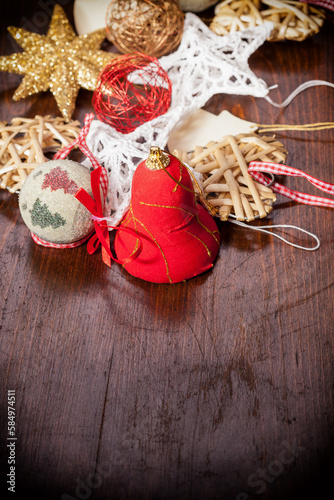 Different christmas decorations on wooden background with a vignete photo