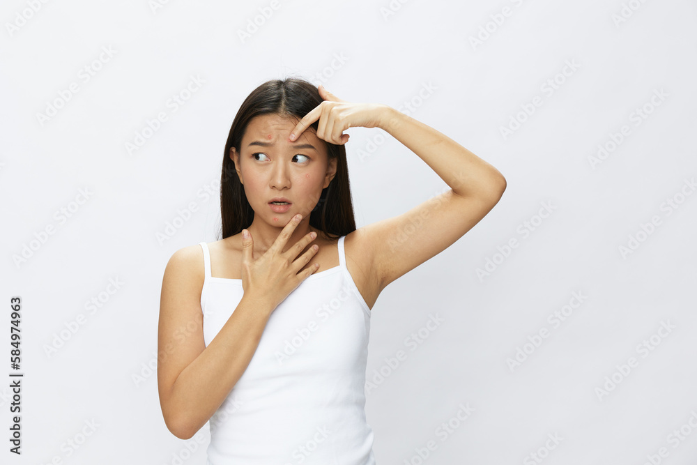 Asian woman facial skin problems, acne and inflammation, red rashes and allergies, chicken pox, sadness from rashes. Facial skin care concept for diseases and nerves Asian woman facial skin problems, acne and inflammation, red rashes and allergies, chicken pox, sadness from rashes. Facial skin care concept for diseases and nerves