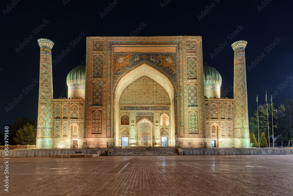 Awesome facade of the Sher-Dor Madrasah in evening