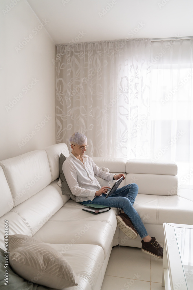 Woman Using Tablet At Home Woman Using Tablet At Home