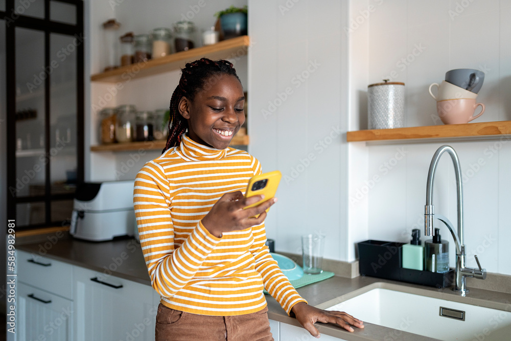 Teenager sending message on cellphone Teenager sending message on cellphone