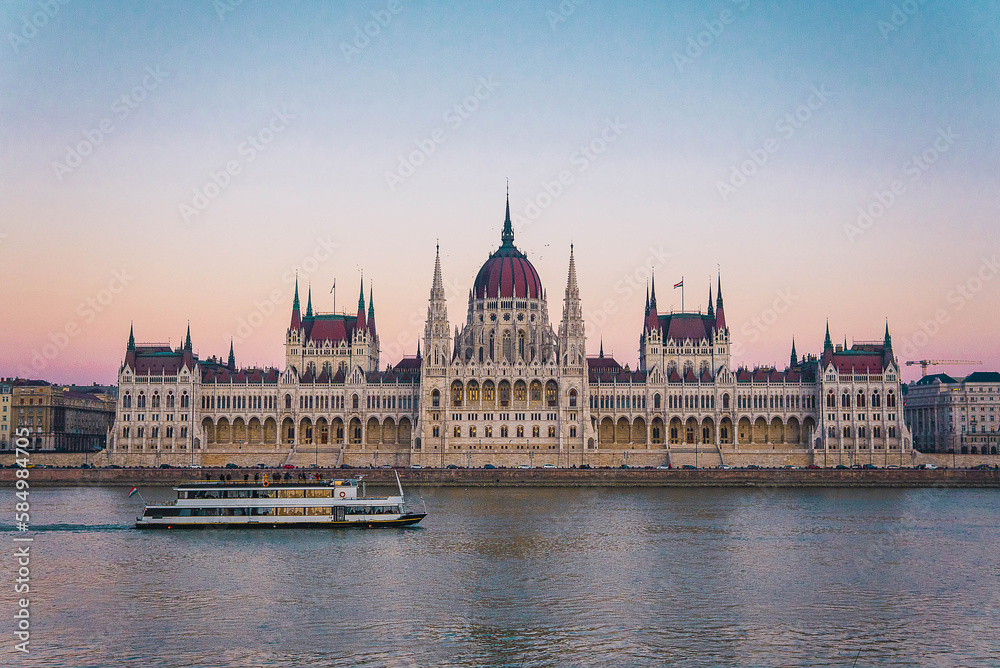 Fototapeta premium parliament of Budapest, from the Danubius river and boat crossing
