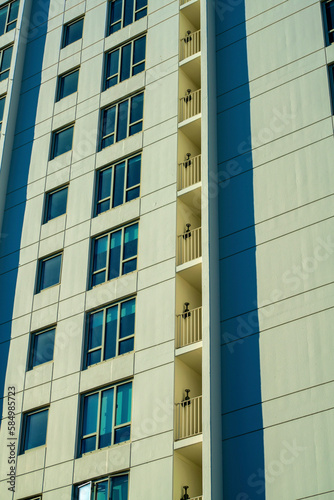 Row of windows on modern real estate hotel apartment building in downtown commercial real estate districts urban city