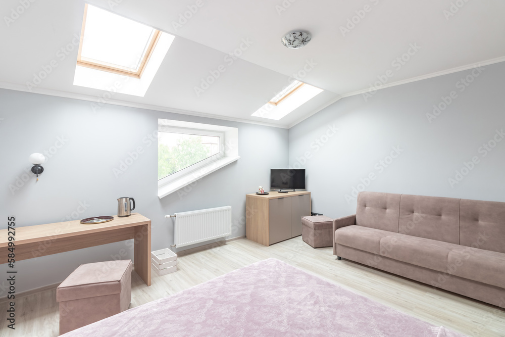 Fototapeta premium Hotel room with a large double bed in light colors