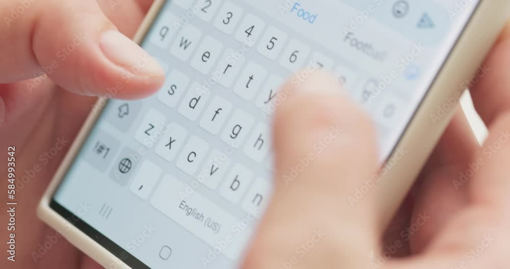 Woman typing a text message on her smartphone. Female hands typing or chatting