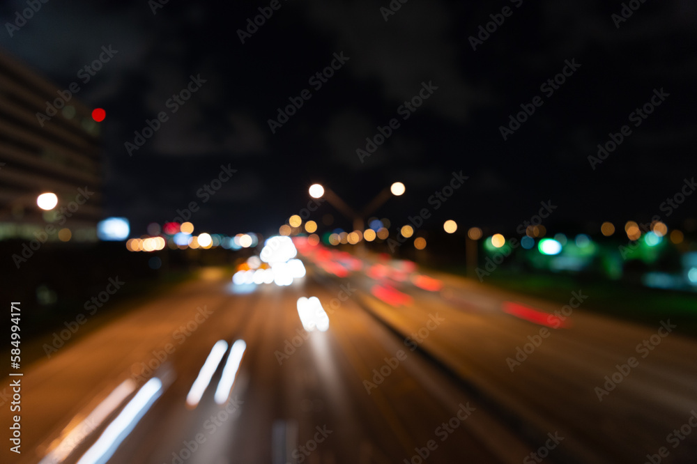 blurry defocused night road. photo of defocused night road. defocused night road and street.