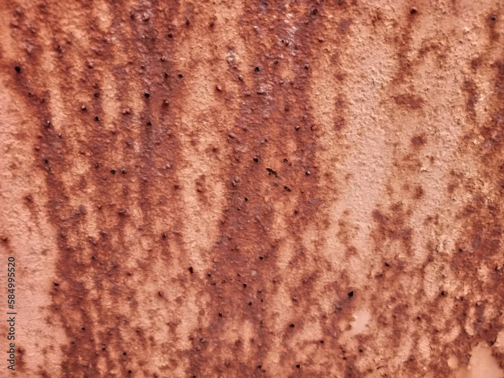 The surface of the old door has an unusual red rust stain. The surface of the old door has an unusual red rust stain.